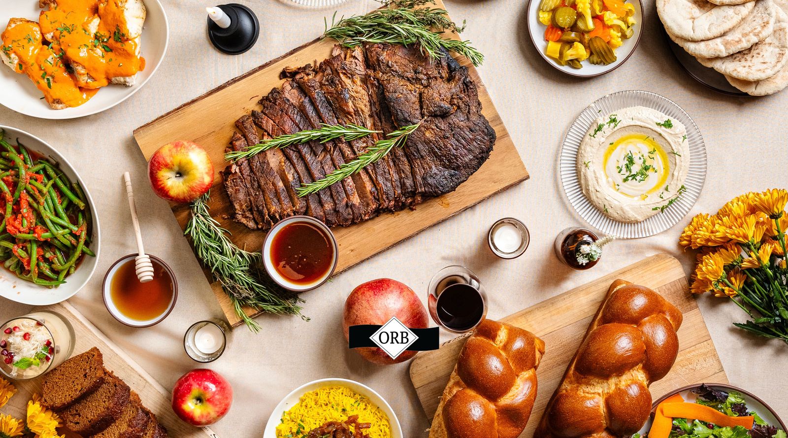 A carved roast resting on a wooden board, part of a Chefaleh Shabbat spread